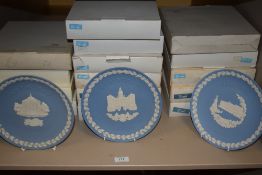 A large quantity of Wedgewood display plates in boxes, including those of christmas and London