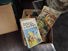 A box of paperback Enid Blyton volumes