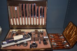 A wooden canteen of chrome plated and stainless steel cutlery, a Stainless and sterling silver