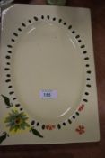 A rectangular plate bearing the name Clarice Cliff, Newport pottery co England to underside having