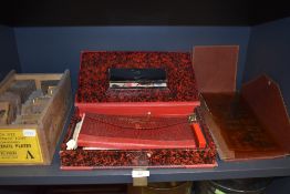 A selection of shop or sign writers tools including brass cut letter set and stencil set