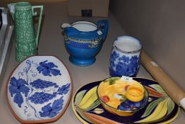 A small selection of ceramics, including green vase with embossed elephant design.
