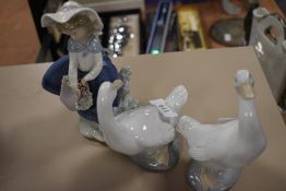 Three figurines, two NAO ducks and a girl with basket by Lladro.