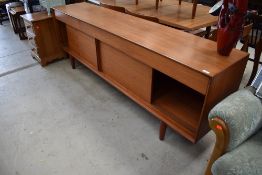 A vintage teak sideboard, Scandinavian probably Danish, triple frieze drawers (centre lined for