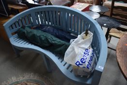 A painted wooden garden bench/love seat of serpentine front and curved back design