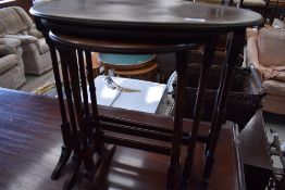 A classical style nest of three mahogany tables, top table width approx. 57cm