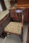A traditional mahogany rail back carver chair, late Victorian or Edwardian, has had worm and been