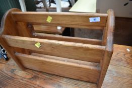 A vintage stained frame magazine rack