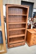 A modern pine bookshelf, approx. dimensions width 87cm height 180cm depth 30cm
