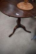 A 19th Century oak pedestal table, diameter approx. 63cm, having tilt top mechanism on triple