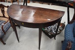 A 19th Century mahogany D end style side table, having square tapered legs, width approx. 114cm