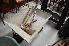 A metal wheelbarrow etc