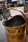 A vintage brass coal helmet