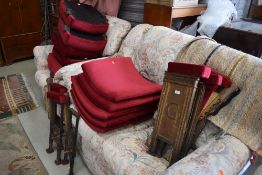 A selection of vintage metal framed and burgundy dralon upholstered cinema seats, believed to have