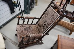 A Victorian stained frame Amercian style rocking chair