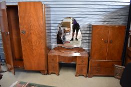 A mid 20th Century walnut bedroom suite