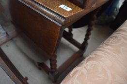An early 20th Century oak twist gate leg dining table, width approx 103cm