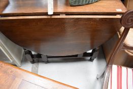 A mid to late 20th Century oak gateleg table, width approx. 90cm