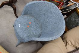 A vintage woven fibre tub style chair in blue, not Lloyd Loom