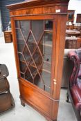 An Edwardian mahogany full height corner display cabinet having astral glazed top with cupboard base