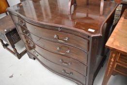 An early 20th Century mahogany serpentine chest of four drawers, and brushing slide, approx. Width