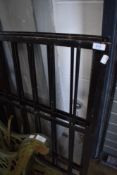 Three metal fence panels