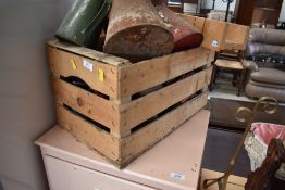 A vintage crate of oil cans etc