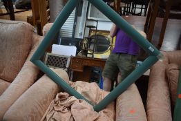 A modern painted wall mirror, approx. 70 x 70cm