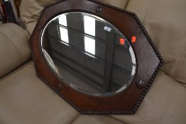 An early 20th Century oak canted wall mirror