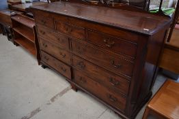 An early 19th Century mahogany Lancashire style bedding chest, with lift top, three over two dummy