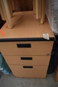 A modern beech laminate three drawer filing cabinet