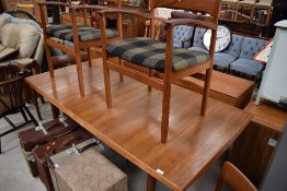 A nice quality vintage teak extending dining table and six (four plus two) chairs, Scandinavian