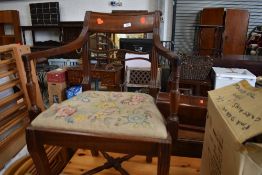 A traditional mahogany carver chair having tapestry seat