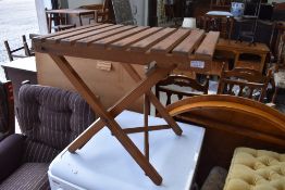 A folding wooden side garden table