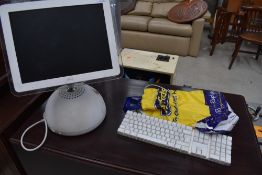 An Apple iMac desktop computer and accesories, serial number W8352078QB6