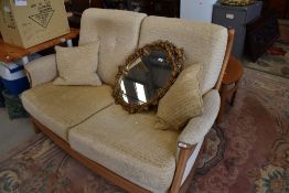 A modern Ercol settee, retailed at over £1500