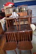 A set of four stained frame spindle back chairs, similar to Ercol