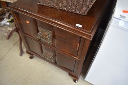 An unusual Oriental inspired mahogany chest of two deep drawers, probably early 20th Century with