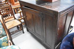 An early 19th Century oak panelled cupboard on stile frame, approx. dimensions W122 H108 D58