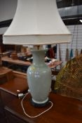 A large Oriental vase type floor or table lamp of jade green Oriental design, height of base approx.
