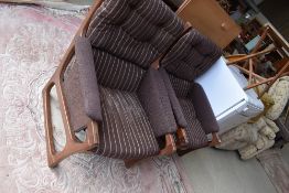 A pair of vintage dark stained teak armchairs, having original brown pin stripe upholstery, very