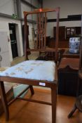 An Edwardian mahogany bedroom chair