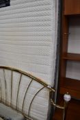 A double (137cm) orthapedic bed and mattress, with brass headboard