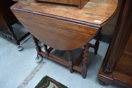A mid 20th Century oak twist gateleg dining table, approx. width 91cm