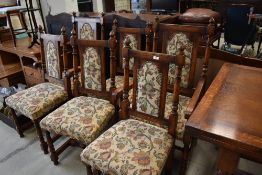 A top quality reproduction oak set of six (four plus two) dining chairs with floral upholstered