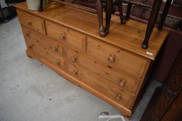 A modern pine low sideboard/chest of three over two by two drawers, would make a good widescreen