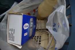 An alabaster lamp and selection of telephones