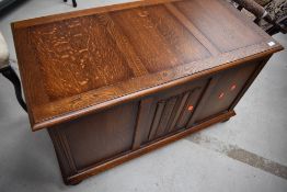 A mid 20th Century oak blanket box, having linen fold decoration to panel, approx. width 96cm