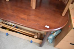 A mahogany effect oval dining table , approx. 150 x 90cm