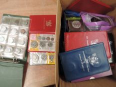 A box of mainly GB and New Zealand coins including year sets and crowns